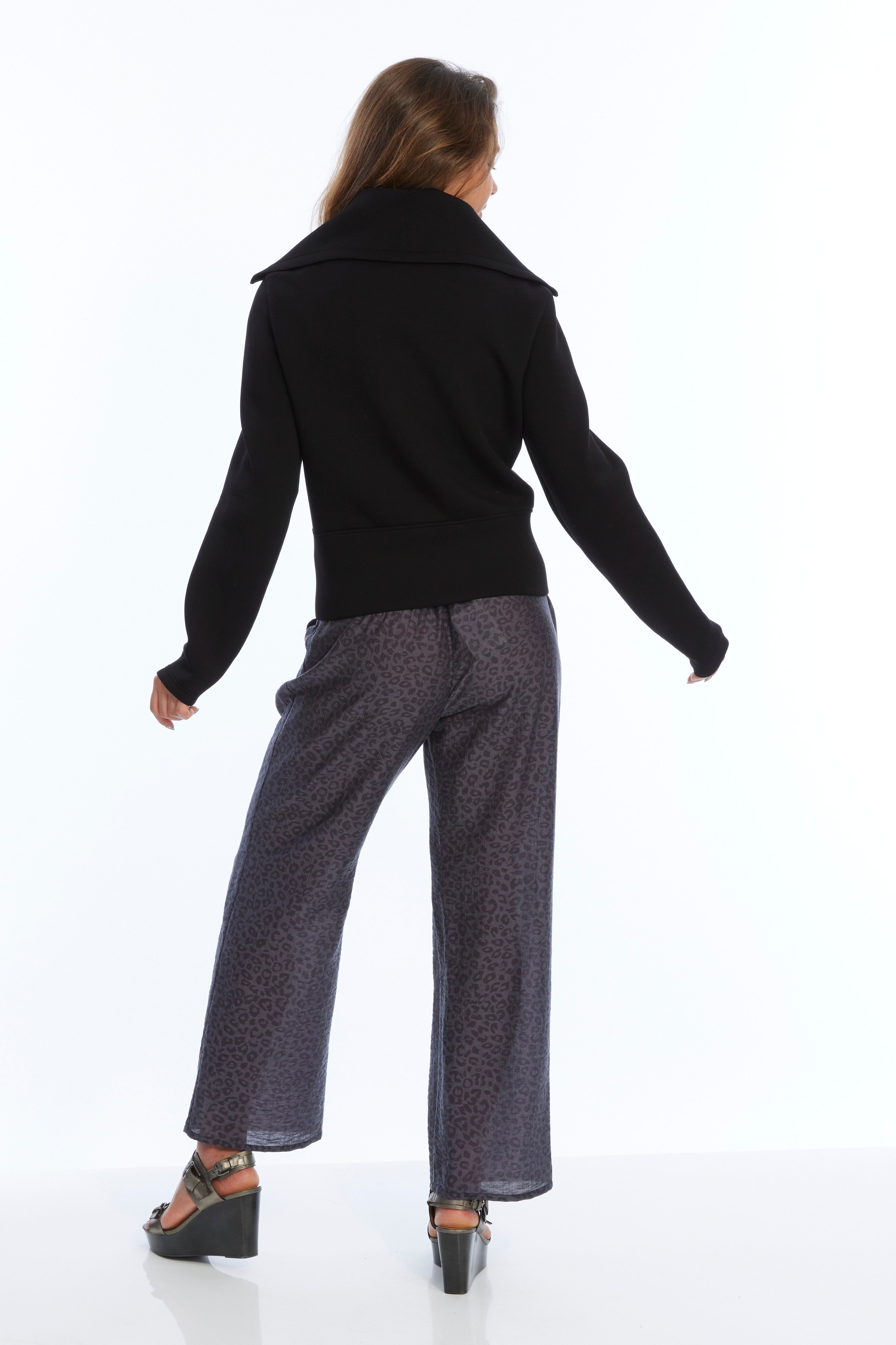 Sleek black buttery ponte jacket featuring a stylish front zip for a chic look