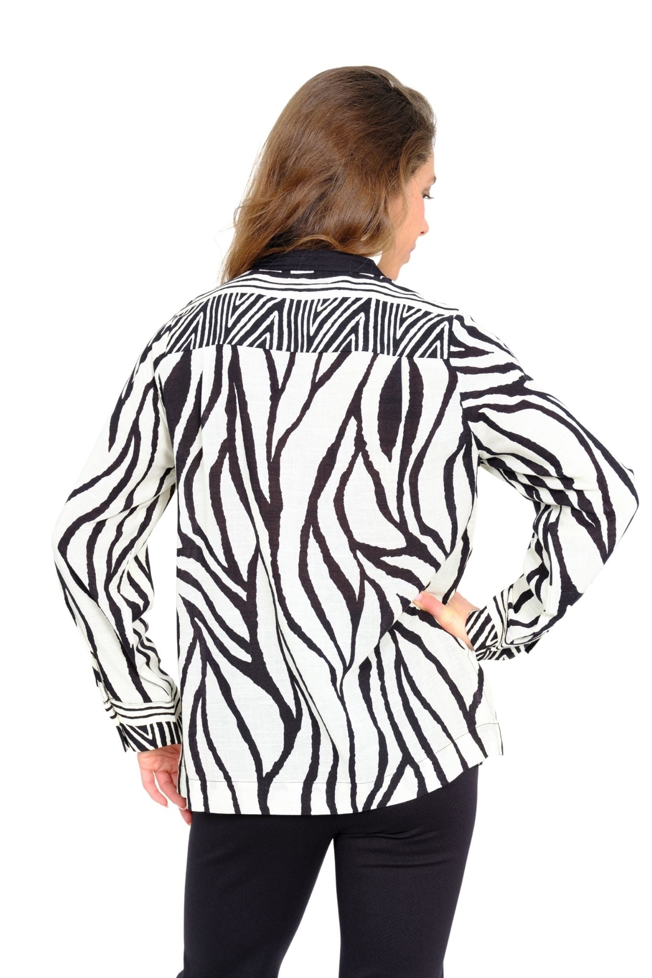 Women’s zebra print long sleeve tunic by LIOR with contrast split neckline and relaxed fit