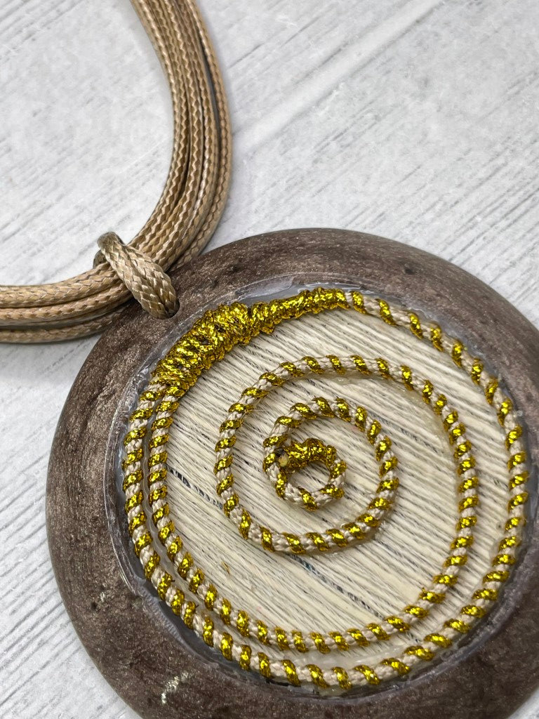 Alisha D Beige Resin Pendant Necklace With Golden Spiral