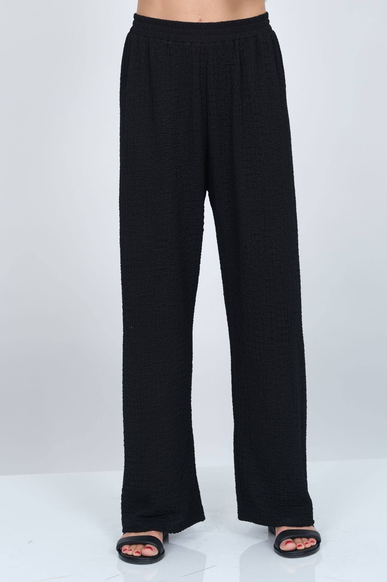 Women’s black waffle knit wide leg pull-on pant by LIOR with relaxed fit and soft textured fabric